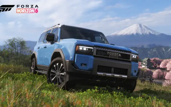4K Ultra HD PC desktop wallpaper of a blue Toyota SUV on grassy terrain with Mount Fuji and cherry blossoms in the background — Forza Horizon 6 video game
