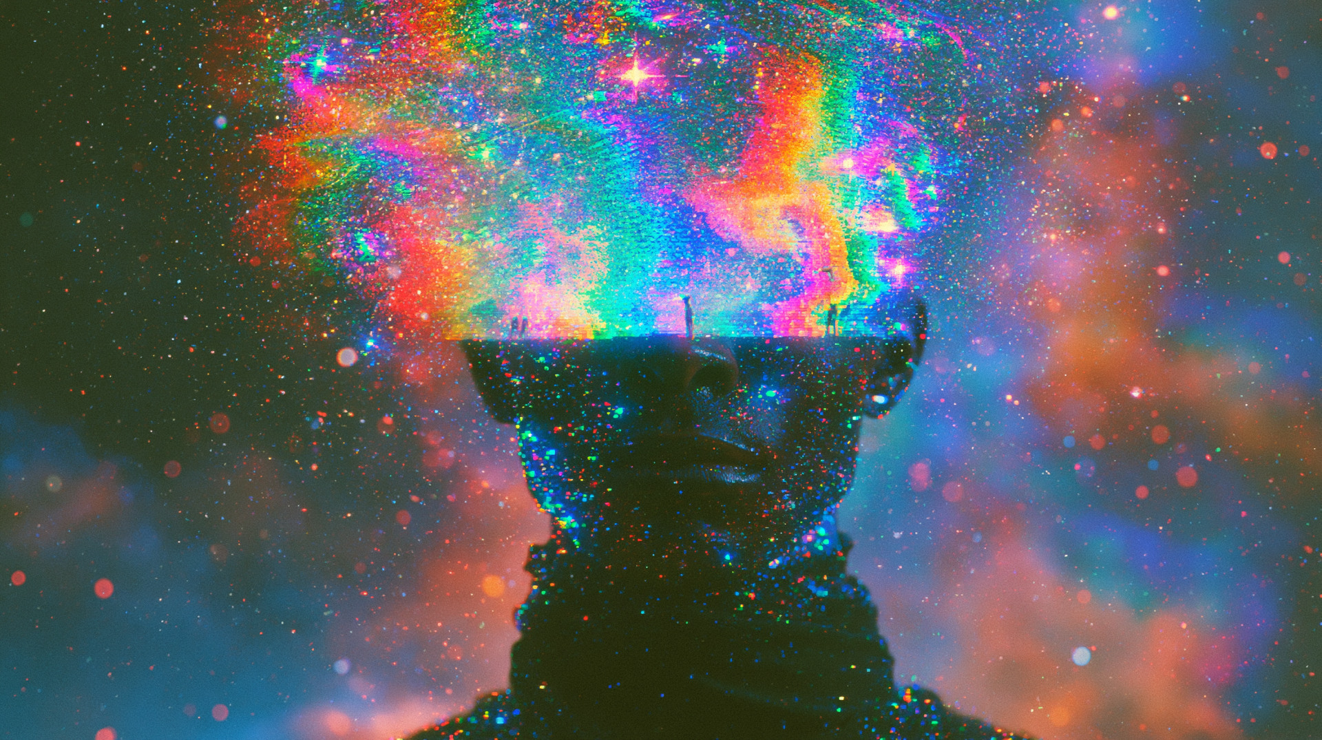 Artistic 2K Quad HD PC wallpaper: silhouetted human bust with a vivid nebula and galaxy erupting from the head amid colorful cosmic clouds.