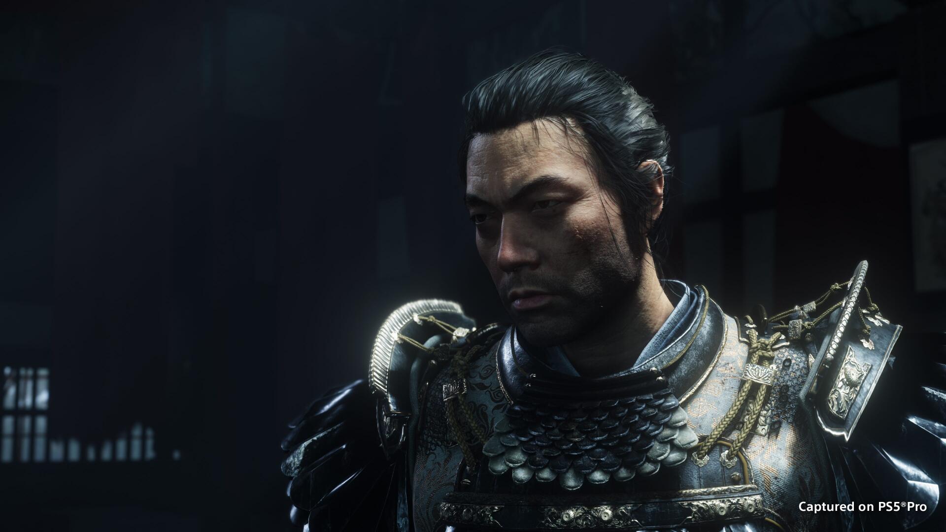 4K Ultra HD PC wallpaper: Jin Sakai as the Ghost of Yōtei, a stoic armored warrior man in detailed samurai armor against a dark, moody background.