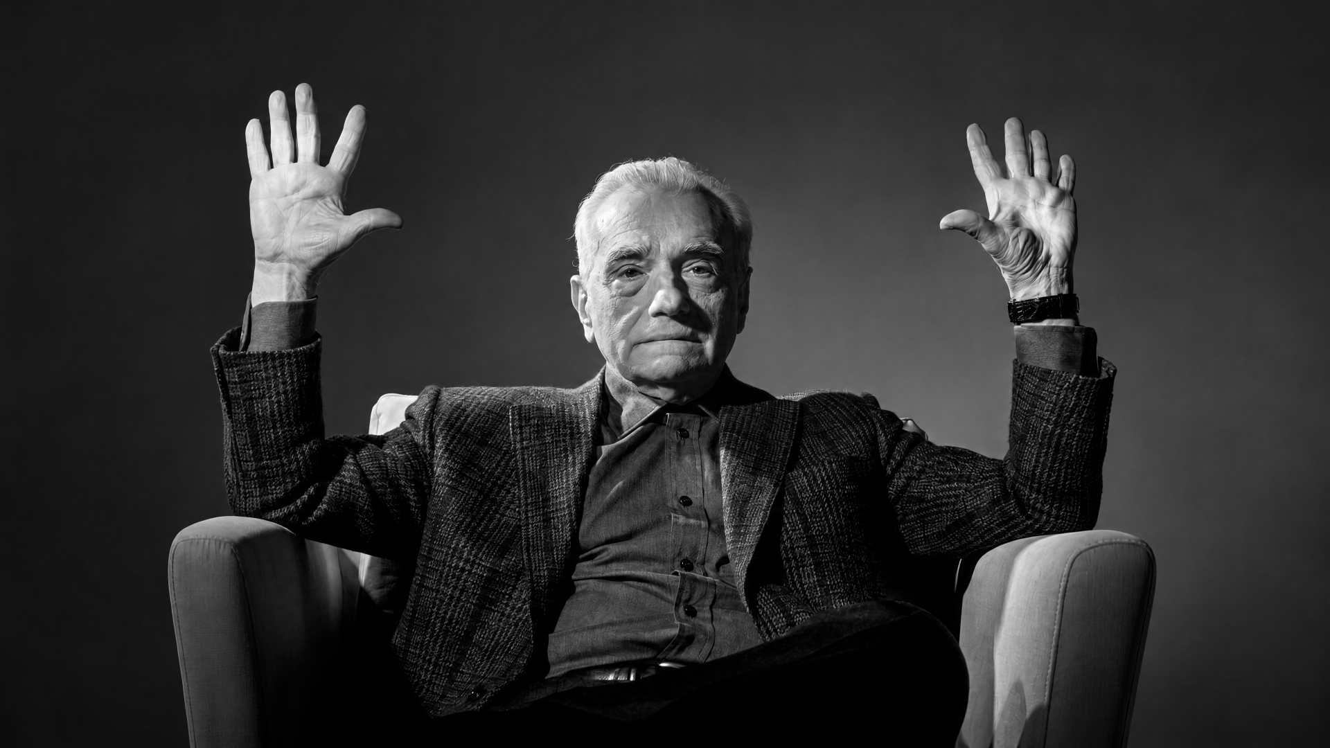 Monochrome portrait of an elderly man in an armchair raising both hands; Absolute Cinema meme aesthetic, 4K Ultra HD PC desktop wallpaper/background.