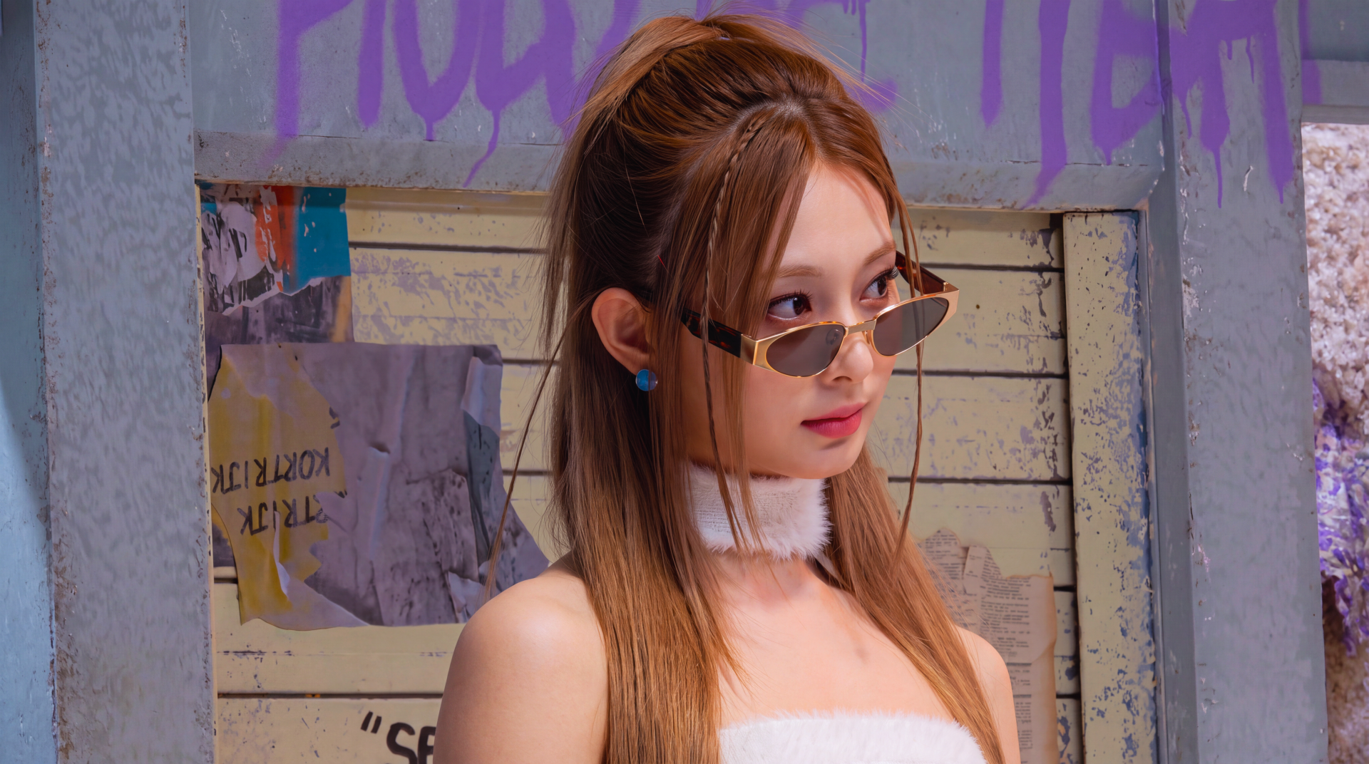 5K Ultra HD desktop wallpaper: young woman in slim shades, white tube top and choker, long brown hair and blue studs, posing in front of a graffiti-covered wall.