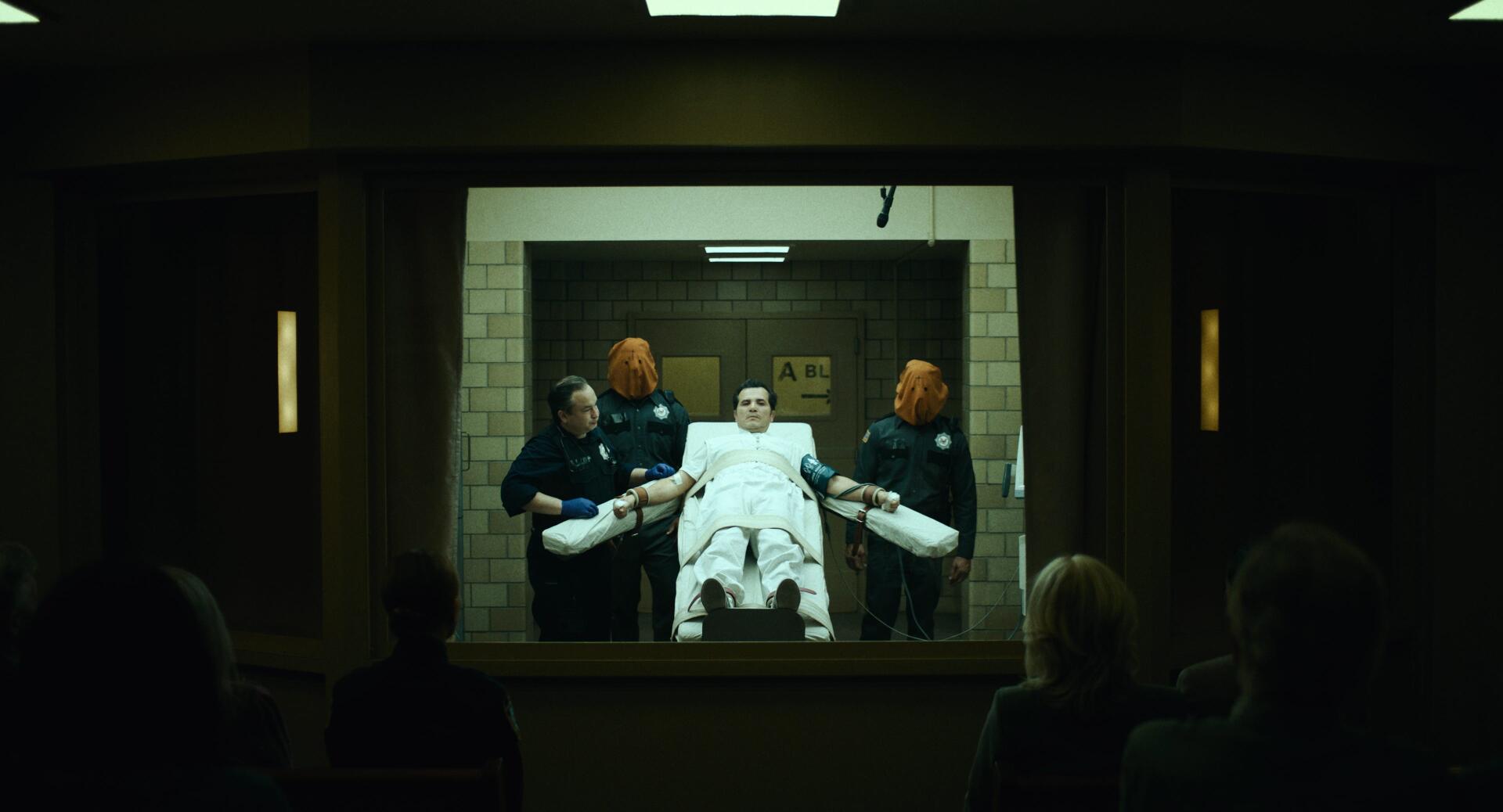 The Exorcist: Martyrs 2K Quad HD desktop wallpaper showing a patient on a stretcher in a dim hospital room.