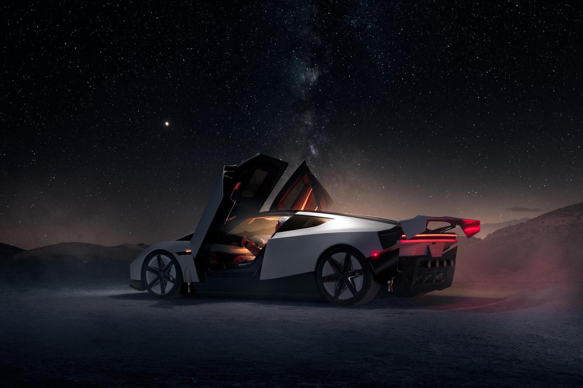 Tesla Roadster futuristic electric car on a dark night road, 2K Quad HD desktop wallpaper