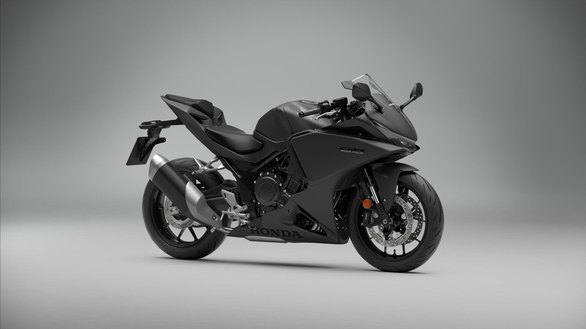 Honda CBR500R sport bike in a sleek side view, featured in a 5K Ultra HD desktop wallpaper.