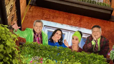 Vecinos 4K Ultra HD PC desktop wallpaper: four colorful neighbors leaning from a balcony over lush green foliage, smiling and dressed in bright, playful outfits in a warm street-side scene.