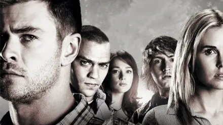 HD PC desktop wallpaper for The Cabin in the Woods: close, tense group portrait of five young adults against a cloudy backdrop, desaturated cinematic tones.