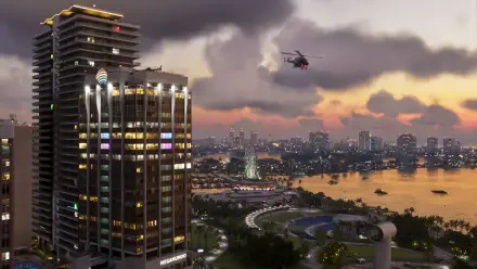 4K Ultra HD PC desktop wallpaper of a Grand Theft Auto VI/Vice City video game cityscape at dusk, lit skyscraper, waterfront and a helicopter.