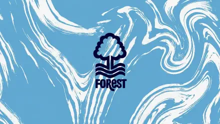 Nottingham Forest F.C. logo centered on light blue and white marbled swirls — 2K Quad HD PC desktop wallpaper/background.