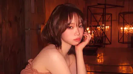 5K Ultra HD PC wallpaper: warm, candlelit portrait of a short-haired Korean model styled like a K-pop idol, contemplative pose in an industrial interior with lantern lighting.