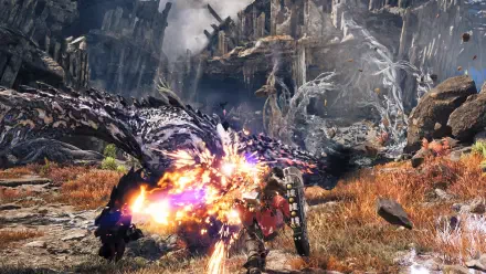 Monster Hunter Wilds — Ascendance: a hunter clashes with a colossal dragon monster amid rocky wilds, a fiery blast illuminating the fight. 4K Ultra HD PC desktop wallpaper and background.