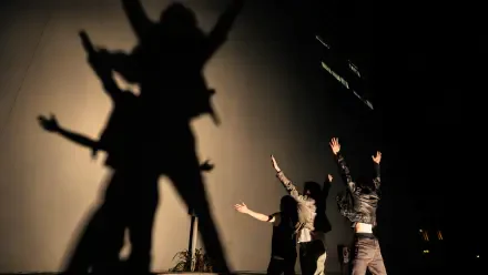 Cortis fashion performers cast dramatic silhouettes and shadows on a backlit wall — 4K Ultra HD PC desktop wallpaper/background.