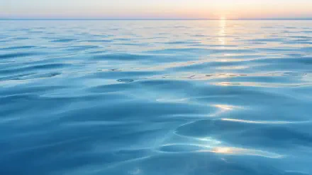 4K Ultra HD PC desktop wallpaper/background of calm ocean water with gentle ripples and sunlit reflections stretching to the horizon