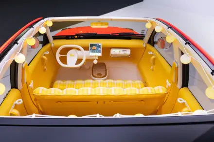 HD desktop wallpaper of the Citroën 2CV concept car interior, featuring a white steering wheel and bright yellow cabin.