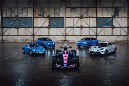 Alpine A526 race car with sports cars in an industrial garage, featured in an 8K Ultra HD PC desktop wallpaper background.