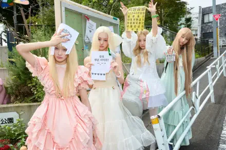 ILLIT members in pastel dresses pose outdoors with signs in this 4K Ultra HD Break Even PC desktop wallpaper and background.