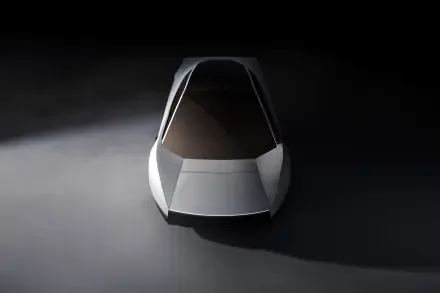 Front view of a silver Tesla Roadster concept car in a dark studio, 2K Quad HD PC desktop wallpaper and background.