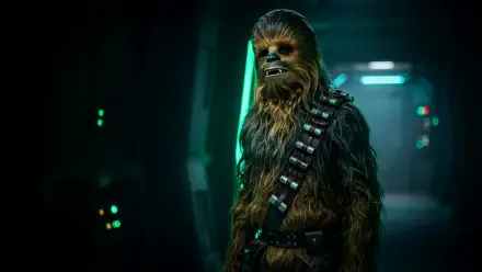 Chewbacca, the Wookiee from Star Wars, stands in a dark sci-fi corridor in this 4K Ultra HD PC desktop wallpaper and background.