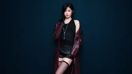 BABYMONSTER K-pop star Asa in a burgundy coat, black outfit, and thigh-high stockings against a dark blue backdrop, 5K Ultra HD desktop wallpaper.