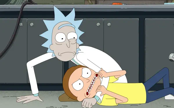 TV show Rick and Morty season 9 HD PC desktop wallpaper/background: Rick pins a struggling Morty to a lab floor, holding his face while Morty grimaces.
