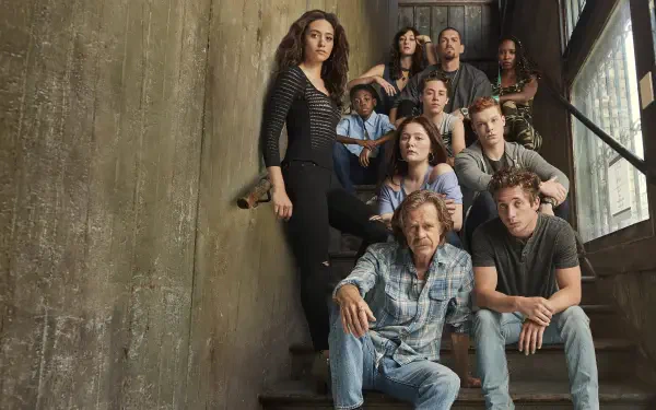 Shameless 4K Ultra HD PC desktop wallpaper: gritty family group on a concrete staircase, varied ages and expressions, moody natural light.