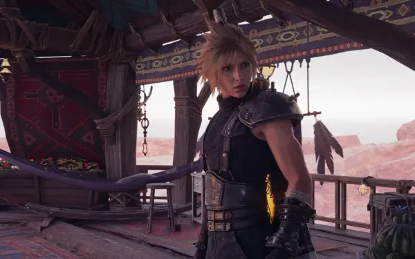Cloud Strife from Final Fantasy VII Rebirth in a desert outpost, wind-tossed hair and armor — cinematic 4K Ultra HD PC desktop wallpaper/background.