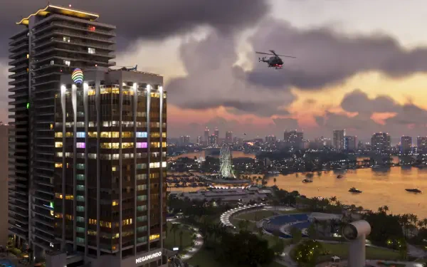 4K Ultra HD PC desktop wallpaper of a Grand Theft Auto VI/Vice City video game cityscape at dusk, lit skyscraper, waterfront and a helicopter.