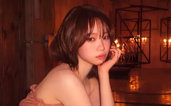 5K Ultra HD PC wallpaper: warm, candlelit portrait of a short-haired Korean model styled like a K-pop idol, contemplative pose in an industrial interior with lantern lighting.