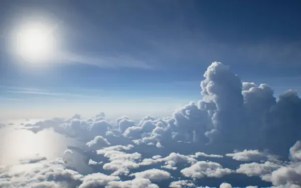 Ace Combat 8: Wings of Theve HD PC desktop wallpaper and background — sunlit sky with towering cumulus clouds over a bright horizon.