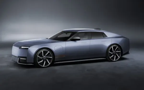 Jaguar Type 01 electric concept car in a sleek studio setting, 8K Ultra HD desktop wallpaper and background.
