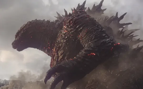 Godzilla Minus Zero looms through smoke in a dramatic 5K Ultra HD desktop wallpaper featuring the colossal monster.