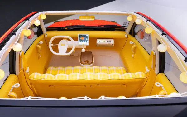 HD desktop wallpaper of the Citroën 2CV concept car interior, featuring a white steering wheel and bright yellow cabin.