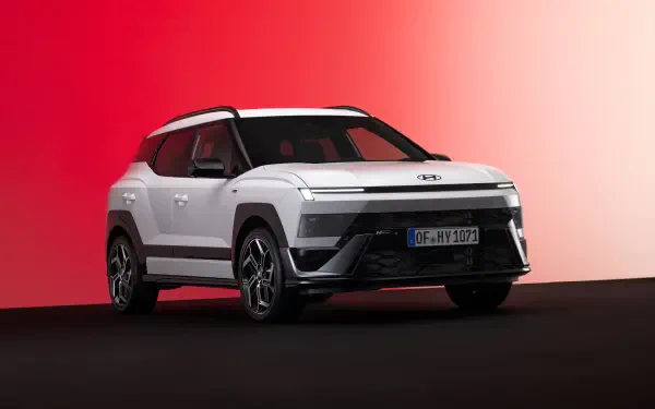 Hyundai Bayon electric SUV in a dramatic studio setting, featured in an 8K Ultra HD PC desktop wallpaper and background.
