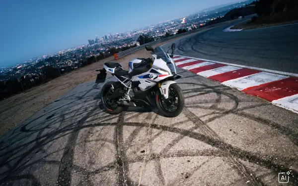 BMW F 450 RR sportbike on a race track at dusk, 4K Ultra HD desktop wallpaper and background.