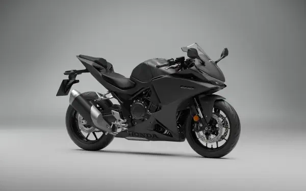 Honda CBR500R sport bike in a sleek side view, featured in a 5K Ultra HD desktop wallpaper.