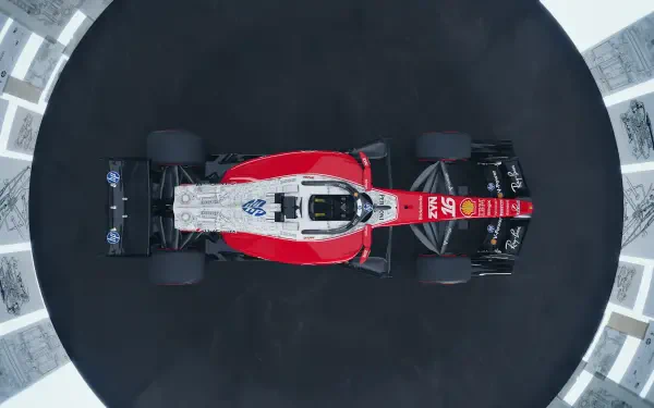 Overhead view of the Ferrari SF-26 Formula One race car on a dark circular track, 4K Ultra HD PC desktop wallpaper.
