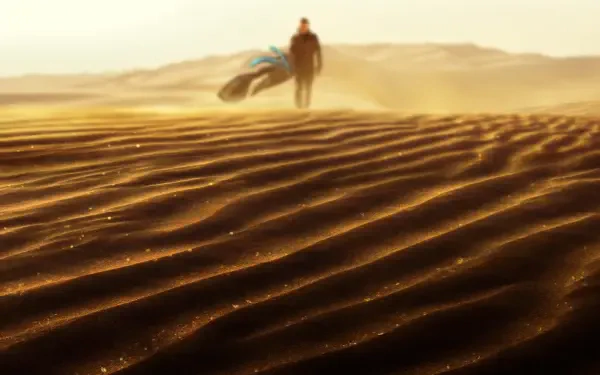 Dune: Part Three 4K Ultra HD PC desktop wallpaper featuring a lone traveler crossing sunlit, rippling desert dunes.