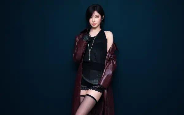 BABYMONSTER K-pop star Asa in a burgundy coat, black outfit, and thigh-high stockings against a dark blue backdrop, 5K Ultra HD desktop wallpaper.