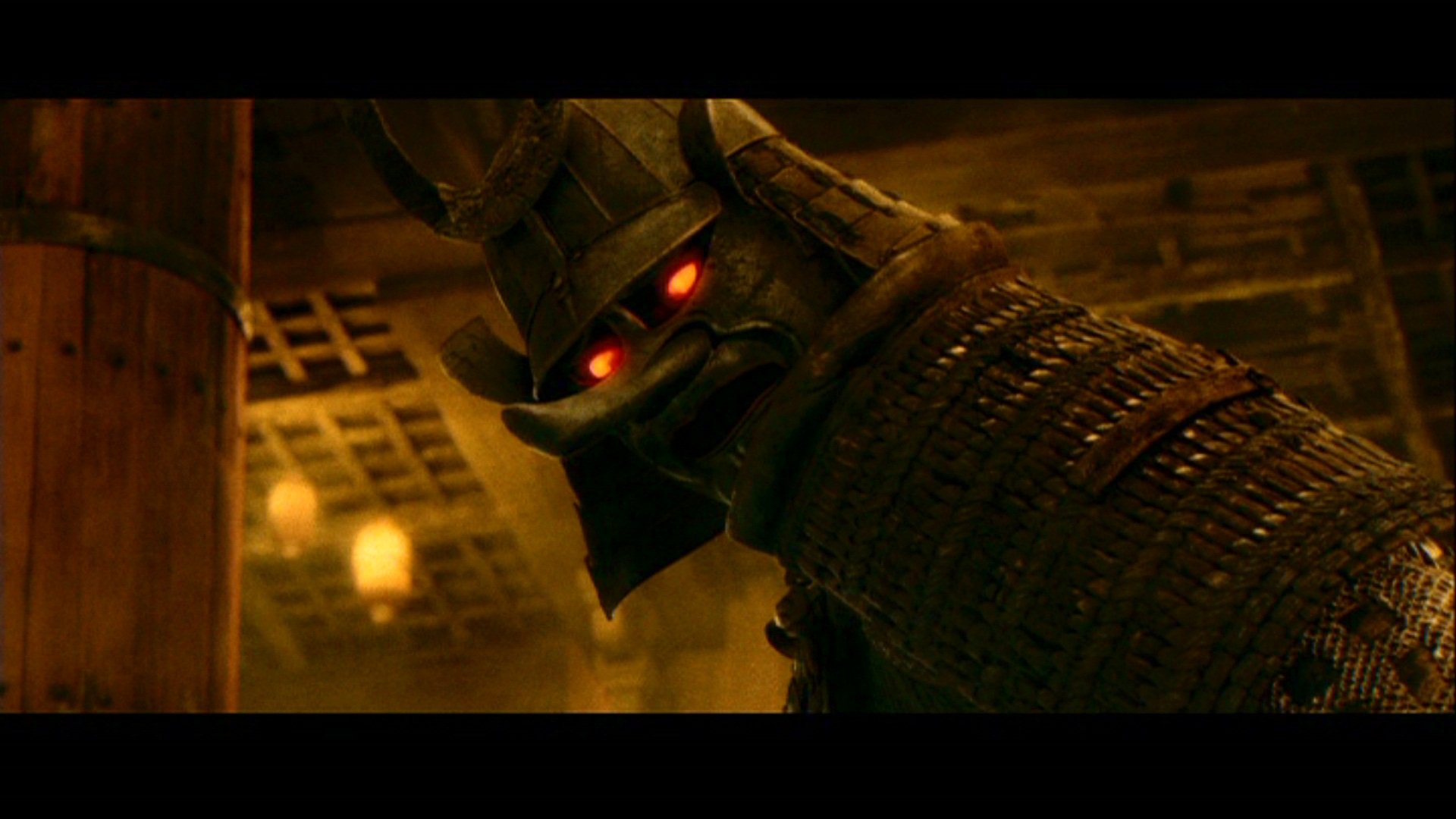 HD PC desktop wallpaper/background from the movie Sucker Punch: close-up of an armored samurai with glowing red eyes in a dim, lantern-lit interior.