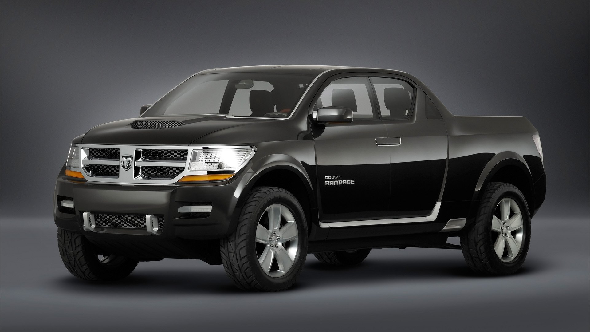 HD desktop wallpaper featuring a sleek black Dodge Rampage vehicle against a gray gradient background.