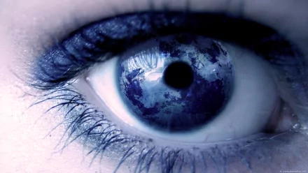 Close-up of an artistic blue eye with detailed texture, designed as an HD PC desktop wallpaper and background.