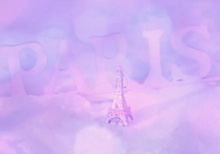 4K Ultra HD desktop wallpaper featuring a delicate, man-made miniature Eiffel Tower against a soft, dreamy pastel background with faint PARIS lettering.