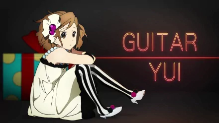 HD desktop wallpaper featuring Yui Hirasawa from the anime K-ON!, showcasing her playful expression alongside bold text reading GUITAR YUI.