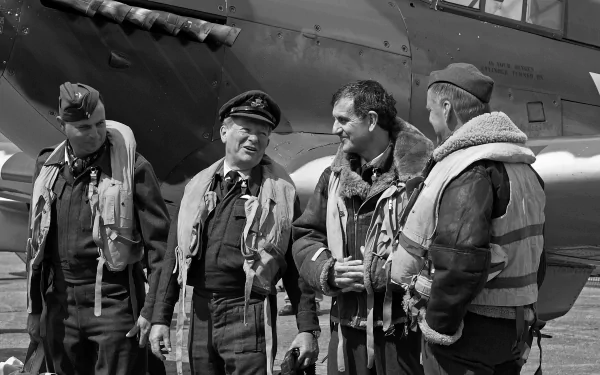 Black-and-white 2K Quad HD PC desktop wallpaper/background showing military aircrew in flight gear chatting beside a Hawker Hurricane fighter on the tarmac.