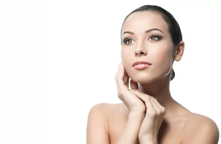 A beautiful woman poses thoughtfully, with a serene expression, showcasing her elegant features. This 4K Ultra HD image serves as a stunning PC desktop wallpaper.