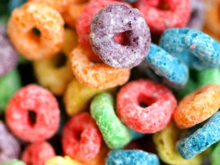 Close-up of vibrant, multicolored cereal loops in HD, themed as a desktop wallpaper and background.