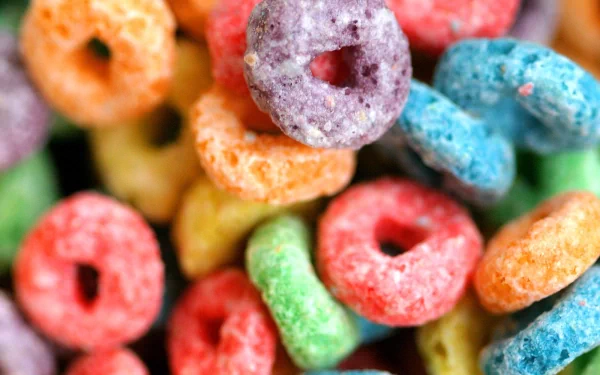 Close-up of vibrant, multicolored cereal loops in HD, themed as a desktop wallpaper and background.
