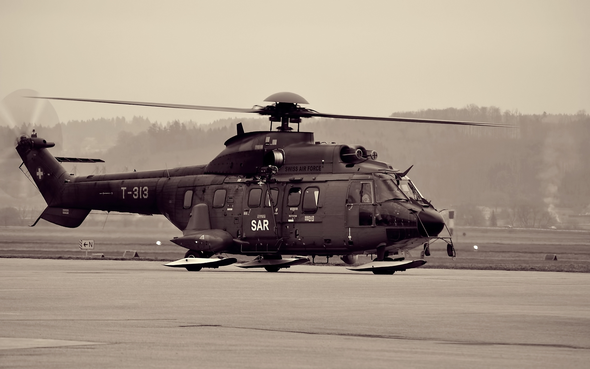 Swiss Air Force Eurocopter AS332 Super Puma helicopter in military action.
