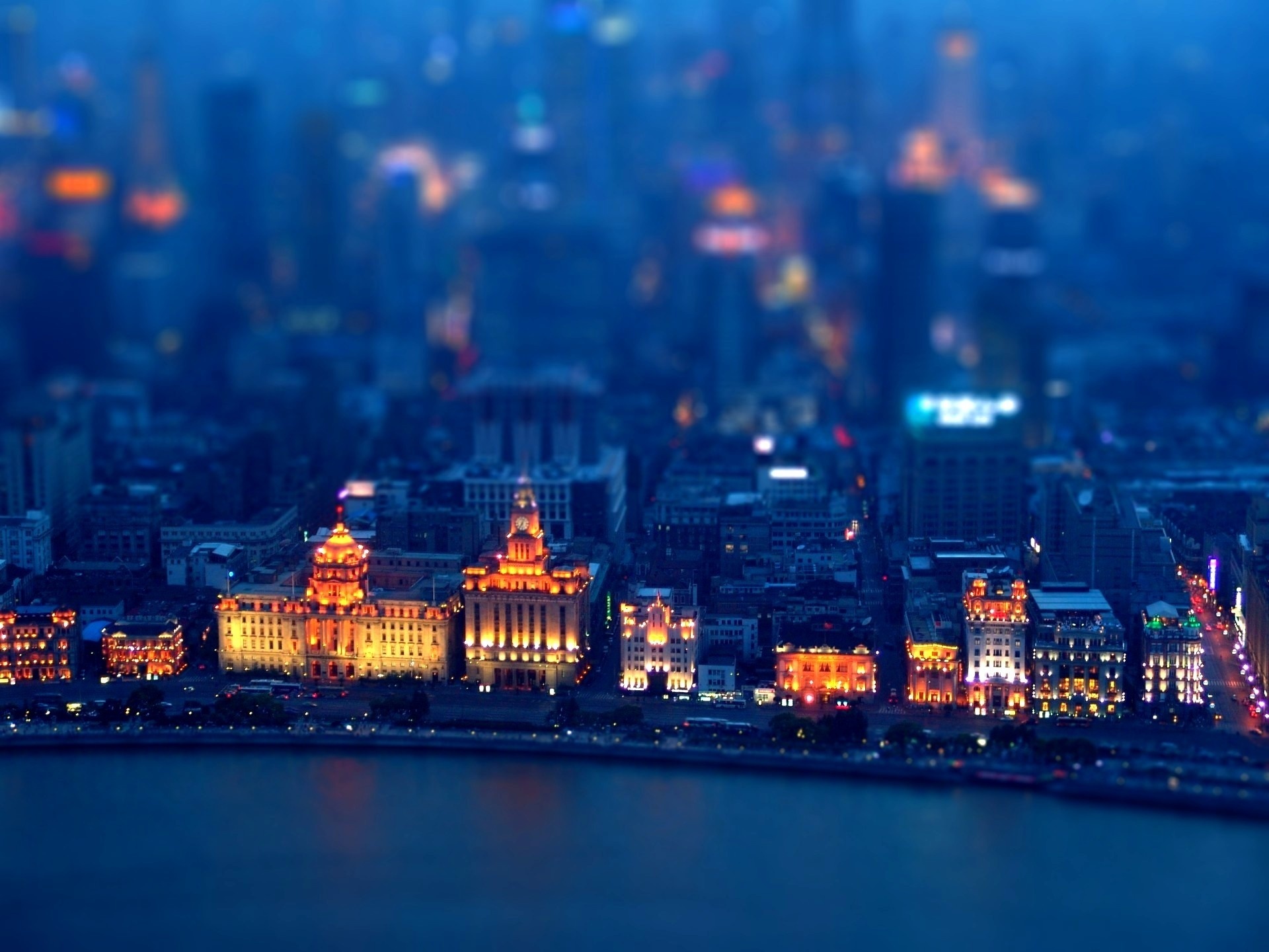 Colorful cityscape at night with tilt-shift effect.