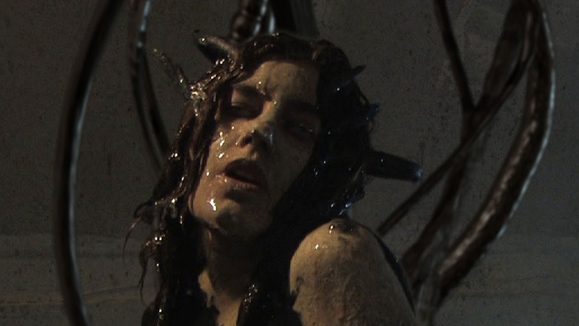 Slime pouring out of a biohazard container in a movie scene.