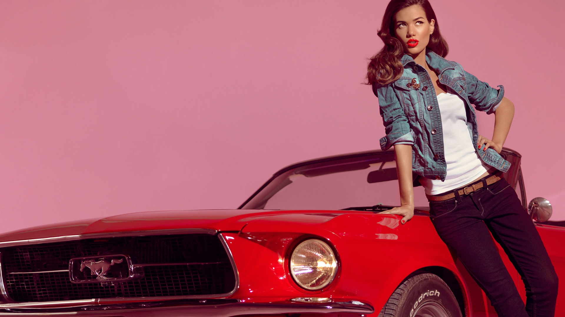 Ford Mustang displayed in front of a group of women, creating an alluring and empowering atmosphere.